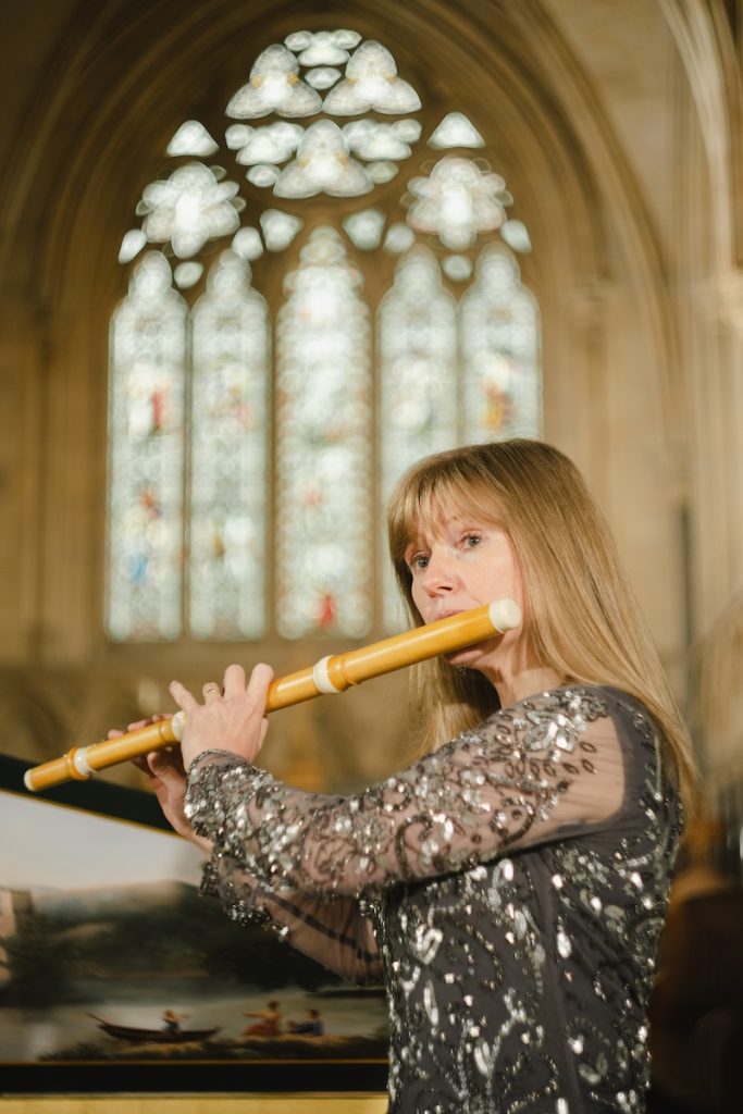 Annabel in a spacious church playing baroque flute